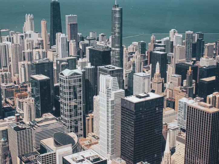 Stunning aerial view of Chicago's skyline showcasing modern skyscrapers against Lake Michigan.