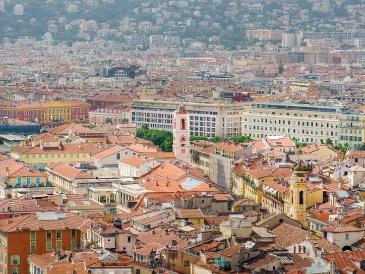 Explore the charming urban landscape of Nice, France, with its iconic red rooftops and historic architecture.