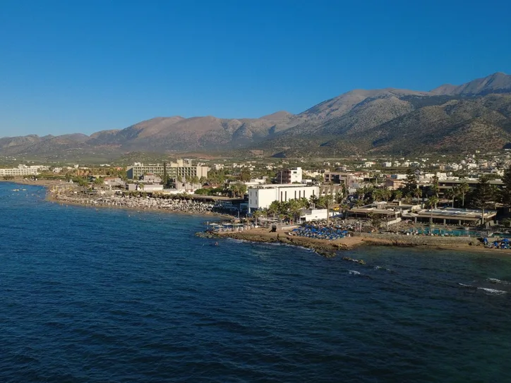 Explore the stunning coastline of Malia, Crete with its clear waters and picturesque landscape.
