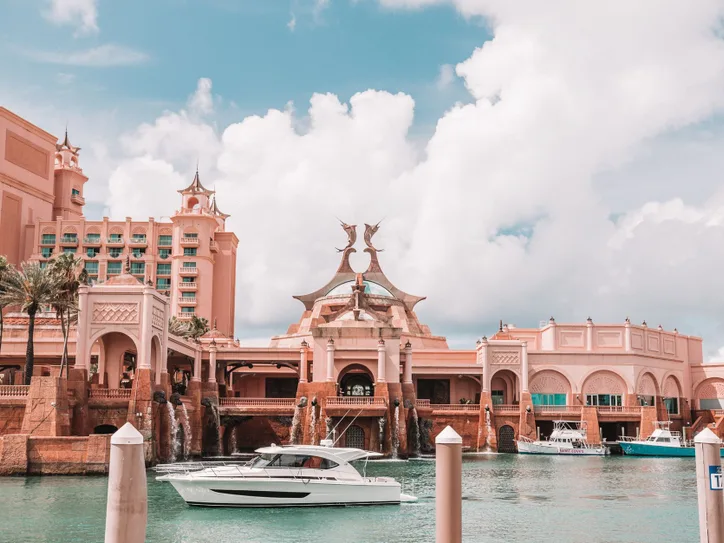 Beautiful architecture of Atlantis Paradise Island with luxury yachts in Nassau, Bahamas.
