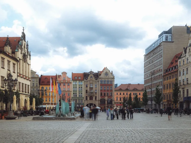 Vibrant view of Market Square in Wroclaw, Poland with historic architecture and lively atmosphere.