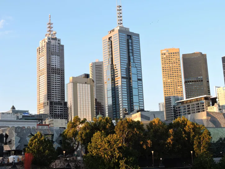 Captivating view of Melbourne's skyline with skyscrapers at golden hour.