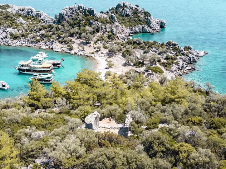 Explore the stunning turquoise waters and lush greenery of Gebekse Bay, Marmaris, Turkey.