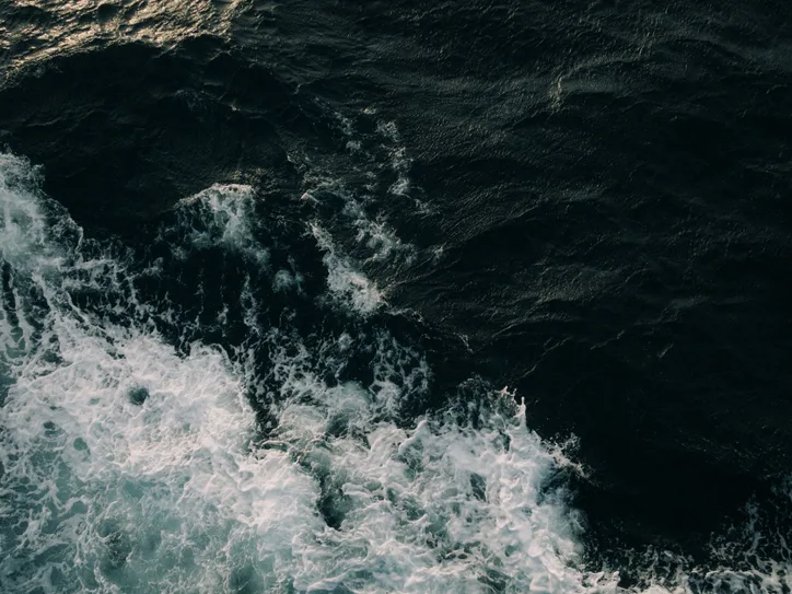 Aerial view of powerful ocean waves crashing in Dumaguete, Central Visayas, Philippines.