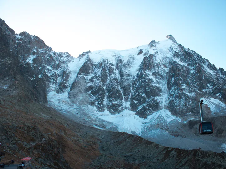 Explore the majestic snow-capped Mont Blanc Massif with a cable car view in Chamonix, France.